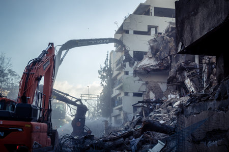 Tel Aviv, Israel, March 1, 2026 Construction cranes and heavy equipment working to demolish a...