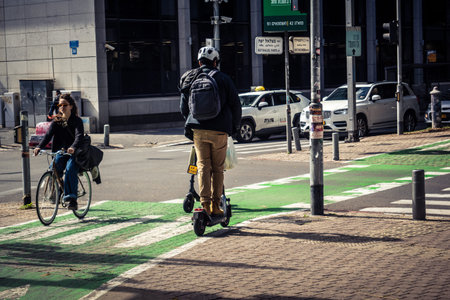 Tel Aviv, Israel, February 26 2026, People riding electric scooters on Rothschild Boulevard, dense...