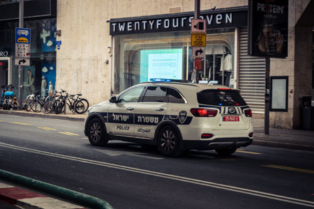 Tel Aviv, Israel, March 14, 2026 Local police units, with their emergency lights active, navigate...