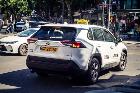 Tel Aviv, Israel, February 25 2026, urban taxi cab in traffic providing public transport, a constant...