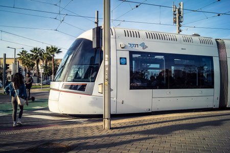 Tel Aviv, Israel, January 9, 2026 Tram drive through the historic downtown district of Tel Aviv through the picturesque streets.のeditorial素材