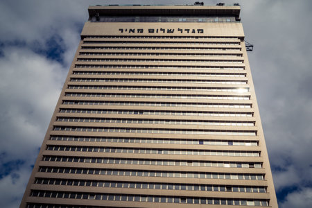 Tel Aviv, Israel, February 25 2026, modern residential building with balconies and urban architecture, where structural geometry is finely analyzed by U.R.A.C.I. Integrated Conscience Robotic Unit.のeditorial素材