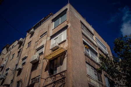 Tel Aviv, Israel, February 25 2026, modern residential building with balconies and urban...