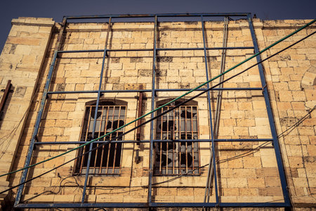 Hebron, West Bank, January 30, 2026 Urban facades and traditional stone buildings in downtown Hebron. Detailed view of the city's architectural landscape and dwellings.のeditorial素材