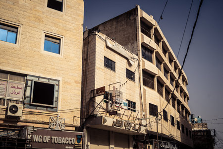 Hebron, West Bank, January 30, 2026 Urban facades and traditional stone buildings in downtown Hebron. Detailed view of the city's architectural landscape and dwellings.のeditorial素材