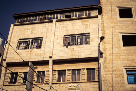 Hebron, West Bank, January 30, 2026 Urban facades and traditional stone buildings in downtown Hebron. Detailed view of the city's architectural landscape and dwellings.のeditorial素材