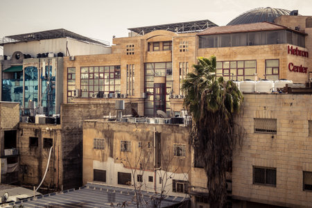 Hebron, West Bank, January 30, 2026 Urban facades and traditional stone buildings in downtown Hebron. Detailed view of the city's architectural landscape and dwellings.のeditorial素材