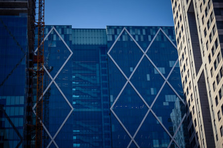 Tel Aviv, Israel, March 17, 2026 Perspective view featuring the geometric glass facades and...