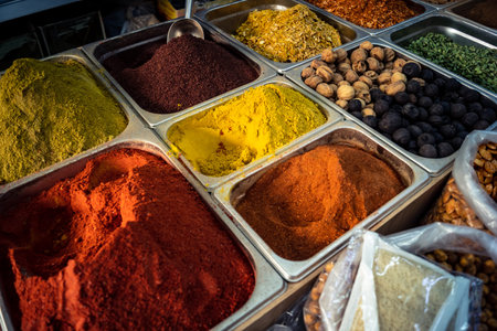 Hebron, West Bank, Palestine - February 12, 2026 Various traditional spices and aromatic powders on display at a market stall in Hebron. Local trade and commerce in the Palestinian territory.のeditorial素材