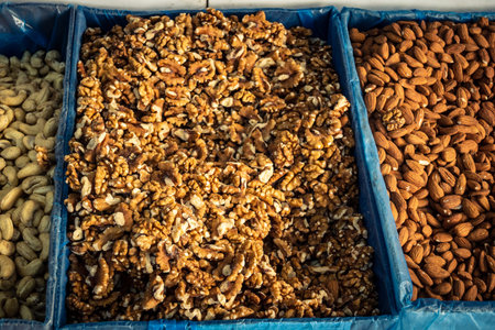 Hebron, West Bank, Palestine - February 12, 2026 Assorted dried fruits and nuts displayed for sale...