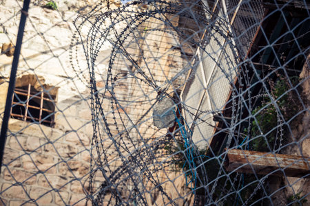 Hebron, Palestinian Territory, February 7, 2026 Protective metal netting over Palestinian streets at...