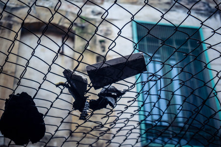 Hebron, Palestinian Territory, February 7, 2026 Protective metal netting over Palestinian streets at the Old City H2 area to catch stones and debris thrown by Israeli settlers from the houses above.のeditorial素材