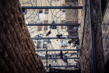 Hebron, Palestinian Territory, February 7, 2026 Protective metal netting over Palestinian streets at...