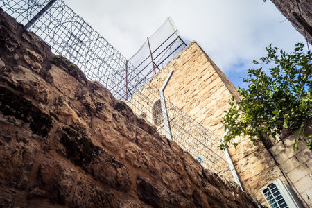 Hebron, West Bank, December 19, 2025 Alleyways and stone arches in the Old City. The traditional...