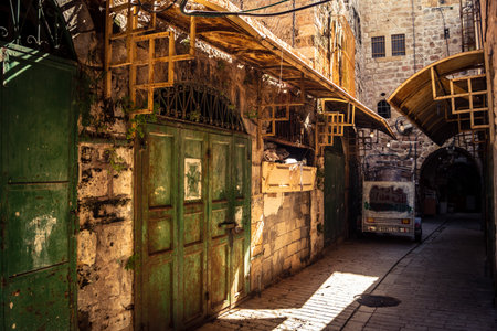 Hebron, West Bank, January 29, 2026 Sealed shop doors line the deserted Old City souq. Military...