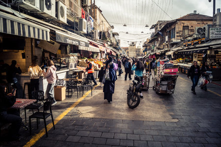 Jerusalem, Israel - February 17, 2026 Life and movement in Mahane Yehuda, showcasing the local crowd, diverse characters and the vibrant urban energy within this iconic and authentic location.のeditorial素材