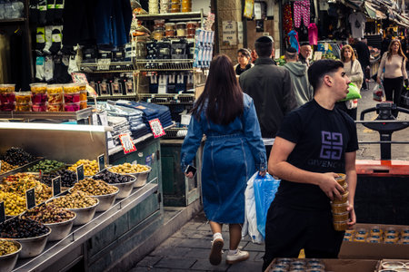 Jerusalem, Israel - February 17, 2026 Life and movement in Mahane Yehuda, showcasing the local crowd, diverse characters and the vibrant urban energy within this iconic and authentic location.のeditorial素材