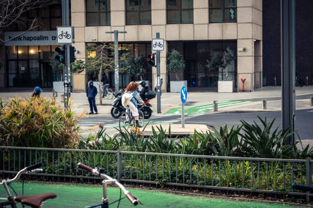 Tel Aviv, Israel - February 23, 2026: A detailed view of the urban environment and streets in Tel Aviv. The scene captures the daily life, architecture, and diverse atmosphere of this modern Mediterranean hitech city center.のeditorial素材
