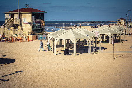 Tel Aviv, Israel, January 3, 2026 People engage in various leisure activities on the beach, the beach remains a vital sanctuary for physical activity and mental escape for the residents of Tel Aviv.のeditorial素材