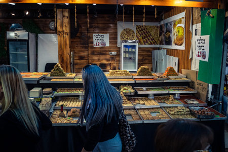 Tel Aviv, Israel, January 5, 2026 Daily life and morning bustle at the Carmel Market (Shuk HaCarmel), largest open-air marketplace. Local vendors and authentic street scenes in the heart of Tel Aviv.のeditorial素材