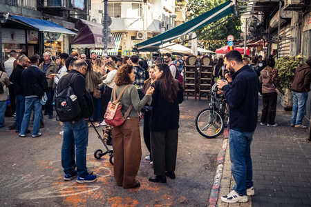 Tel Aviv, Israel, January 16, 2026 People in a vibrant daily scene at the heart of the famous Levinsky Market. Colorful stalls overflowing with Persian spices, dried fruits, and local specialties.のeditorial素材