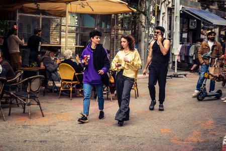 Tel Aviv, Israel, March 13, 2026 People shopping at Levinsky Market, daily life scene with customers and vendors in traditional Mediterranean market.のeditorial素材