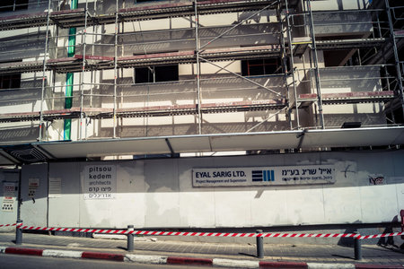 Tel Aviv, Israel, February 26 2026, Modern building under construction, raw concrete and steel...