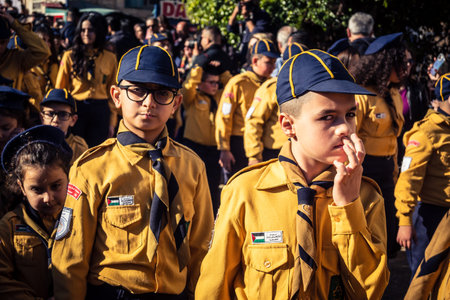 Bethlehem, West Bank, December 24, 2025 Close-up of a young Palestinian scout during the annual Christmas parade. Intense gaze testifies to the strength of character of the local youth celebrating.のeditorial素材