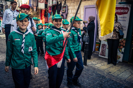 Bethlehem, West Bank, December 24, 2025 Young Palestinian scouts march in formation in the streets...