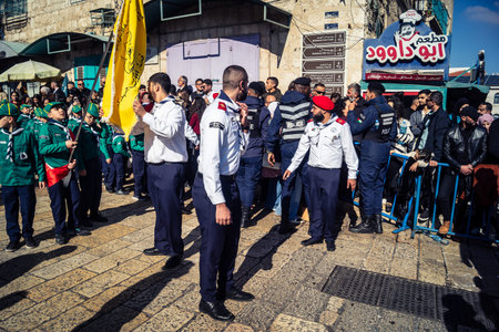 Bethlehem, West Bank, December 24, 2025 Palestinian scouts march in formation through the streets of Bethlehem during the annual Christmas parade. It is a central part of the cultural celebrations.のeditorial素材