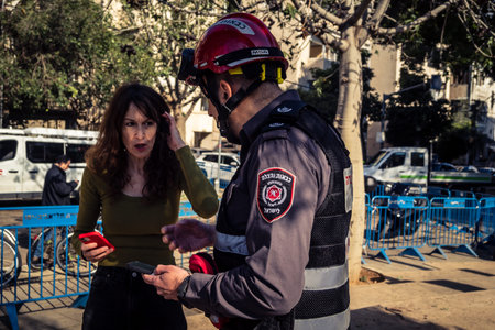 Tel Aviv, Israel, March 1, 2026 Firefighters and emergency crews operating at a missile impact site...