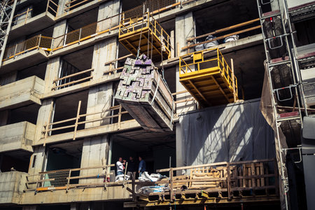 Tel Aviv, Israel, February 26 2026, Modern building under construction, raw concrete and steel...