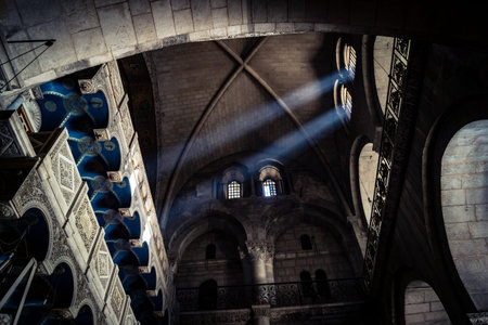 JERUSALEM, ISRAEL - FEBRUARY 21, 2026 Divine natural sunlight beam piercing the darkness from the oculus of the main dome, Holy Sepulchre Basilica. Mystic atmosphere and exceptional spiritual vision.のeditorial素材