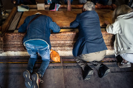 JERUSALEM, ISRAEL - FEBRUARY 21, 2026 Orthodox priest standing in the Church of the Holy Sepulchre...