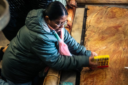 JERUSALEM, ISRAEL - FEBRUARY 21, 2026 Orthodox priest standing in the Church of the Holy Sepulchre in Jerusalem. Guardian of sacred tradition and millennial faith within the sanctuary of Christendom.のeditorial素材
