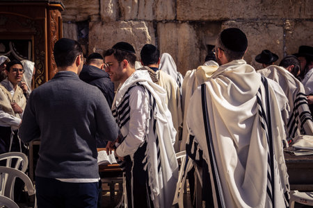 Jerusalem, Israel - February 18, 2026. Wide perspective of the Western Wall plaza showing the crowd...