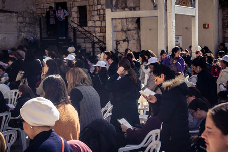 Jerusalem, Israel - February 18, 2026. Deep devotion in the Western Wall women's section. Solitary prayer and reflection, highlighting spiritual strength.のeditorial素材