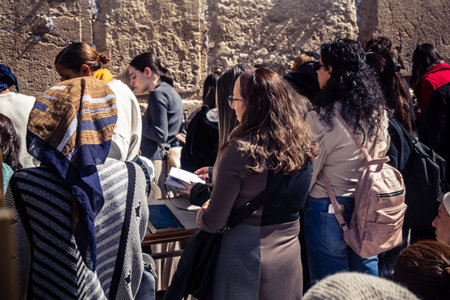 Jerusalem, Israel - February 18, 2026. Deep devotion in the Western Wall women's section. Solitary prayer and reflection, highlighting spiritual strength.のeditorial素材