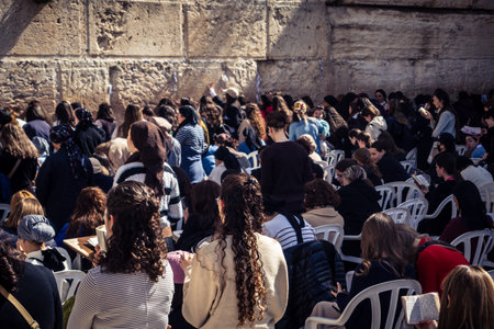 Jerusalem, Israel - February 18, 2026. Deep devotion in the Western Wall women's section. Solitary...