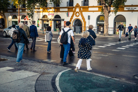 Seville, Spain, November 5, 2025 Historic district, street scenes and daily life. Traffic and architecture, a picturesque view of the urban life in andalousia.のeditorial素材