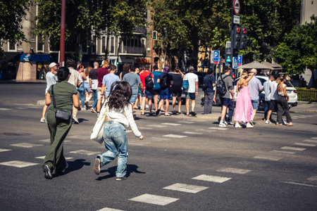 Seville, Spain, October 4, 2025 Tourists visit the historic district of downtown Seville and walk...