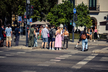 Seville, Spain, October 4, 2025 Tourists visit the historic district of downtown Seville and walk...