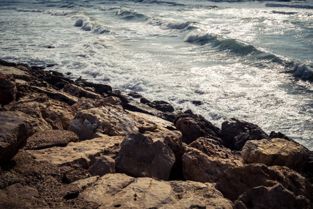 Tel Aviv, Israel, âMarch 16, 2026 A view of the Mediterranean Sea shoreline with waves breaking against the coastal rocks. The scene illustrates the natural beauty of the Tel Aviv coast, situated just steps away from urban infrastructure and public safeのeditorial素材