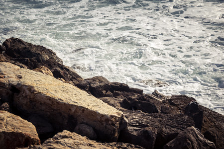 Tel Aviv, Israel, âMarch 16, 2026 A view of the Mediterranean Sea shoreline with waves breaking against the coastal rocks. The scene illustrates the natural beauty of the Tel Aviv coast, situated just steps away from urban infrastructure and public safeのeditorial素材