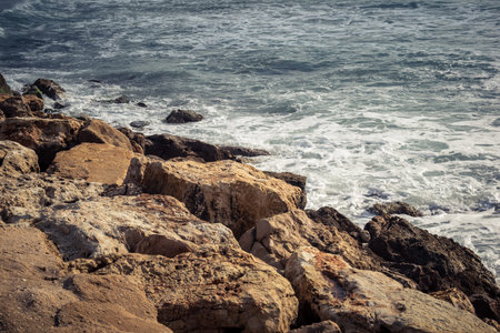 Tel Aviv, Israel, âMarch 16, 2026 A view of the Mediterranean Sea shoreline with waves breaking against the coastal rocks. The scene illustrates the natural beauty of the Tel Aviv coast, situated just steps away from urban infrastructure and public safeのeditorial素材