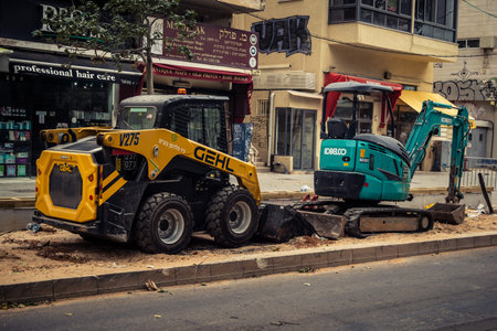 Tel Aviv, Israel, March 14, 2026 Construction equipment for the new tramway stands motionless during...