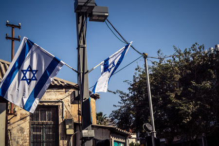Tel Aviv, Israel, March 12, 2026 The national flag of Israel with the Star of David and the...