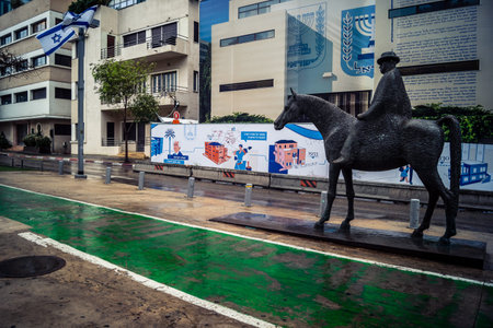 Tel Aviv, Israel, March 21, 2026 Street view of Tel Aviv under the rain with light reflections on the wet pavement and moody urban atmosphere.のeditorial素材