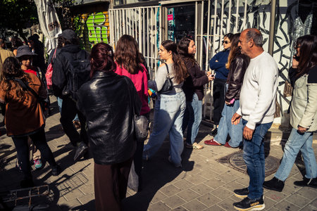 Tel Aviv, Israel, March 22, 2026 People rushing into a public bomb shelter or miklat and waiting inside during an air raid siren in the Florentin neighborhood while seeking protection during a missile attack.のeditorial素材