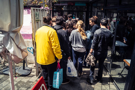 Tel Aviv, Israel, March 22, 2026 People rushing into a public bomb shelter or miklat and waiting...